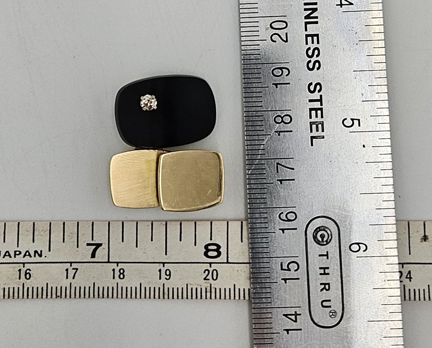 Vintage kunstnerisk 3D modernistisk 14K guld diamant- og sort onyxbrochevedhæng