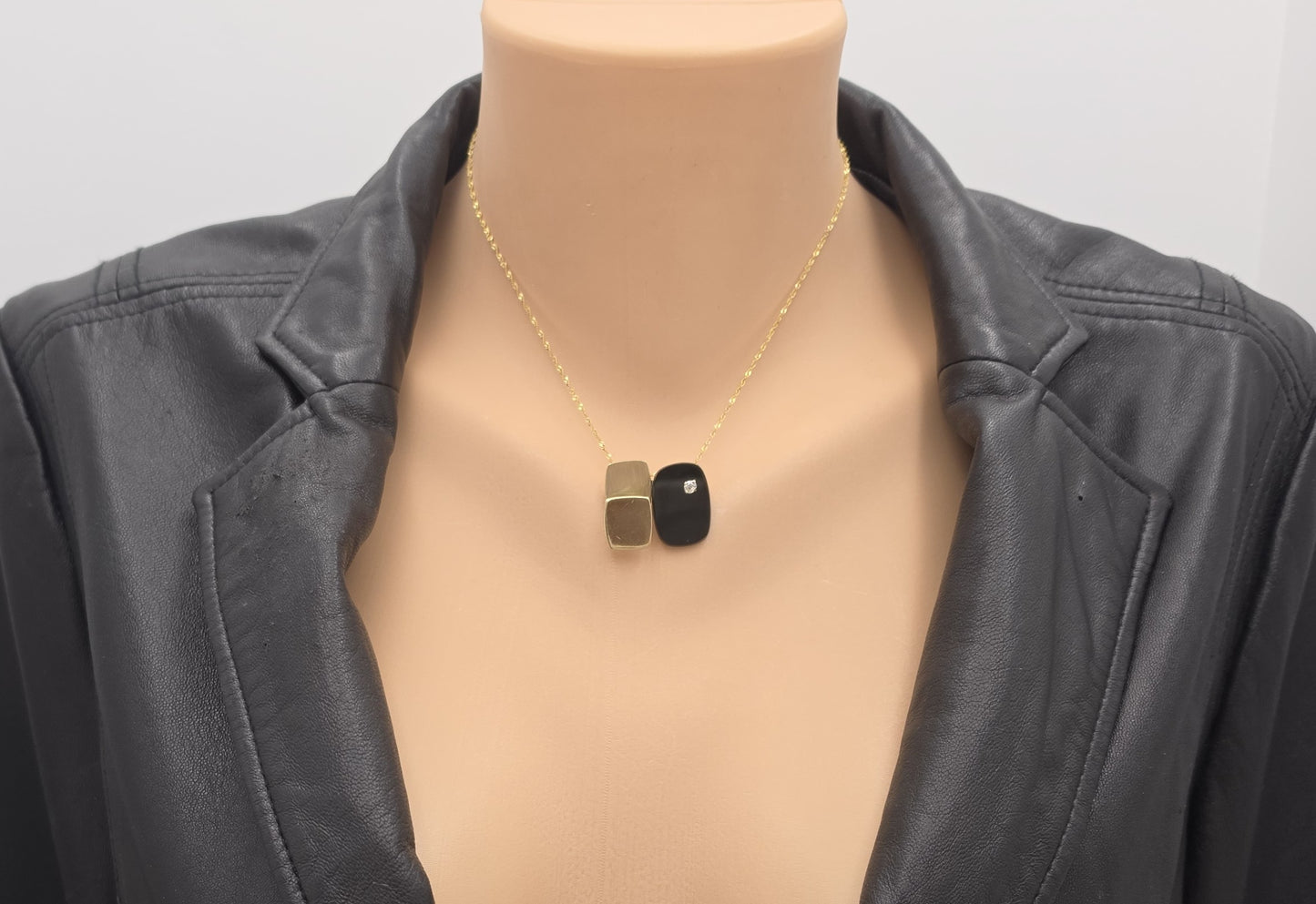 Vintage kunstnerisk 3D modernistisk 14K guld diamant- og sort onyxbrochevedhæng