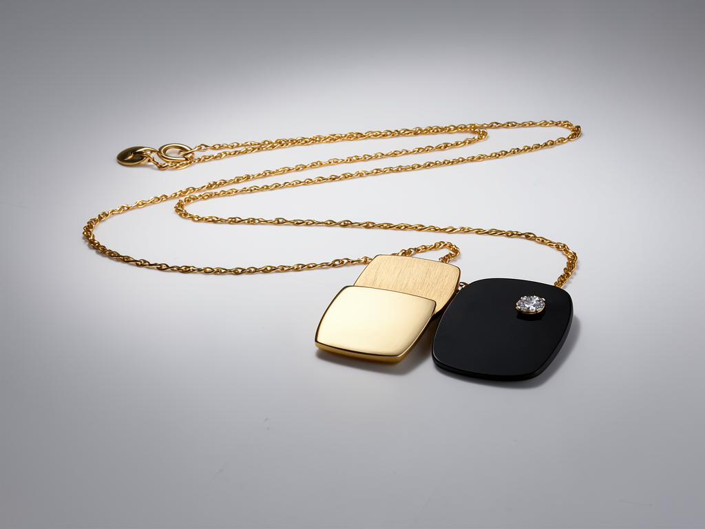 Vintage kunstnerisk 3D modernistisk 14K guld diamant- og sort onyxbrochevedhæng